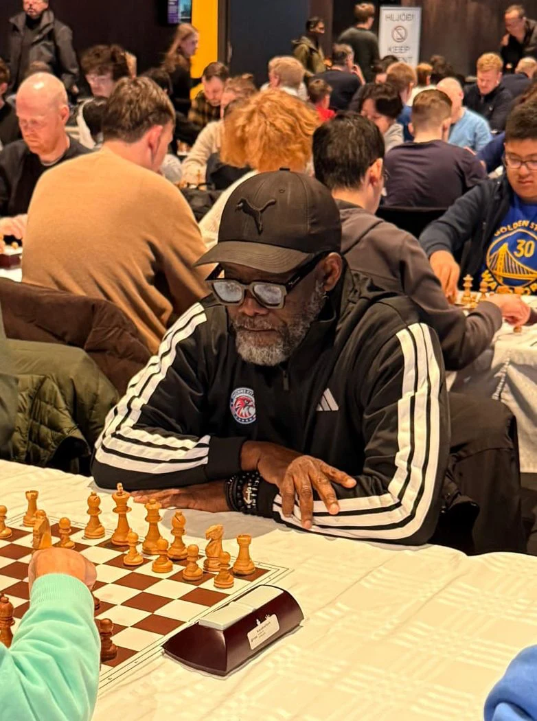 International Master Oladapo Adu playing chess at a tournament